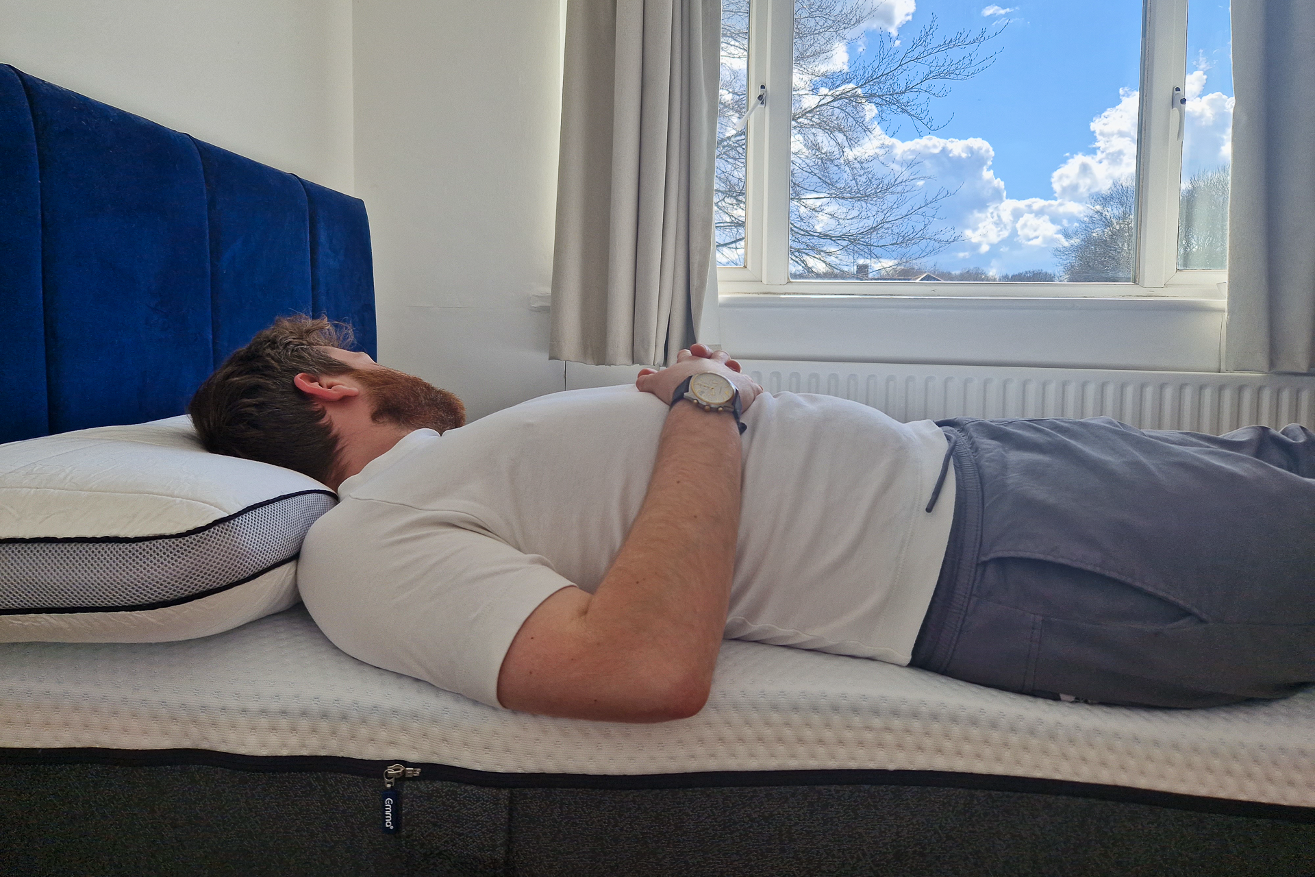 man sleeping on emma premium